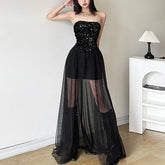 Schwarzes, trägerloses Maxikleid aus transparentem Netzstoff mit Pailletten